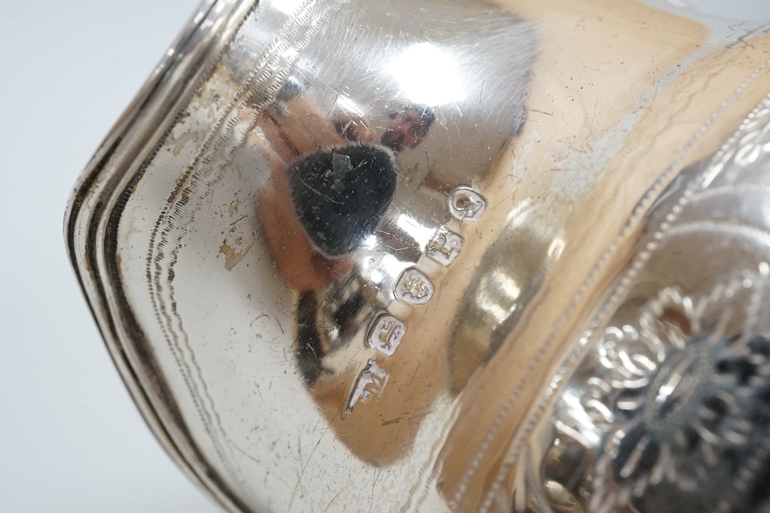 A George III silver cream jug, on four ball feet, London, 1812, 95mm, with engraved foliate band, maker's mark rubbed.